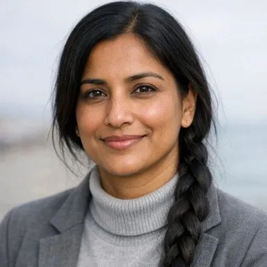 South Asian woman, early forties, long black braided hair, calm expression, sea haze be…